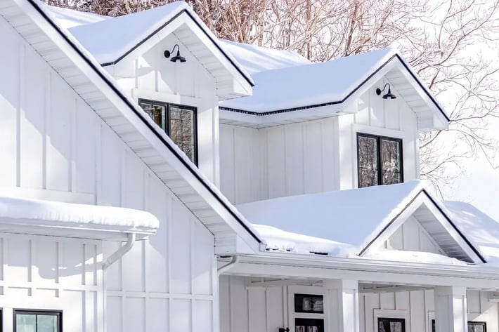 board-batten-siding-white-farmhouse-snow