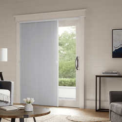 Light grey cellular shades on a sliding glass door in a home living room.