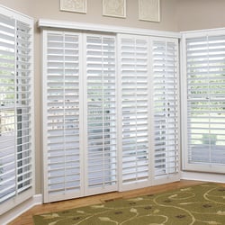 White plantation shutters on sliding glass doors. 