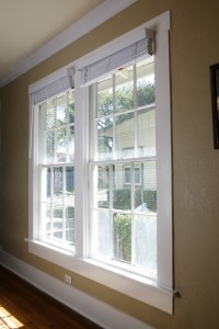 A photo of two double-hung windows with white trim.