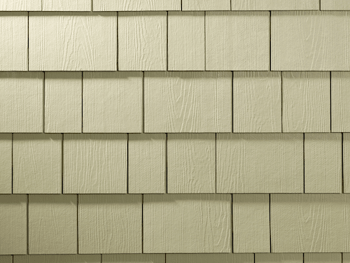 Close-up shot of straight-edge shingle siding in a beige color. 