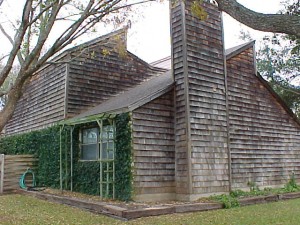 A wooden house with a large chimney