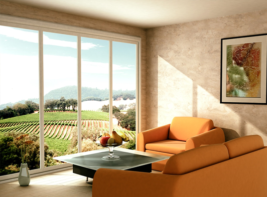 A room with orange furniture and large window views.