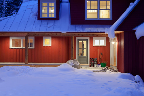 house full of snow outside